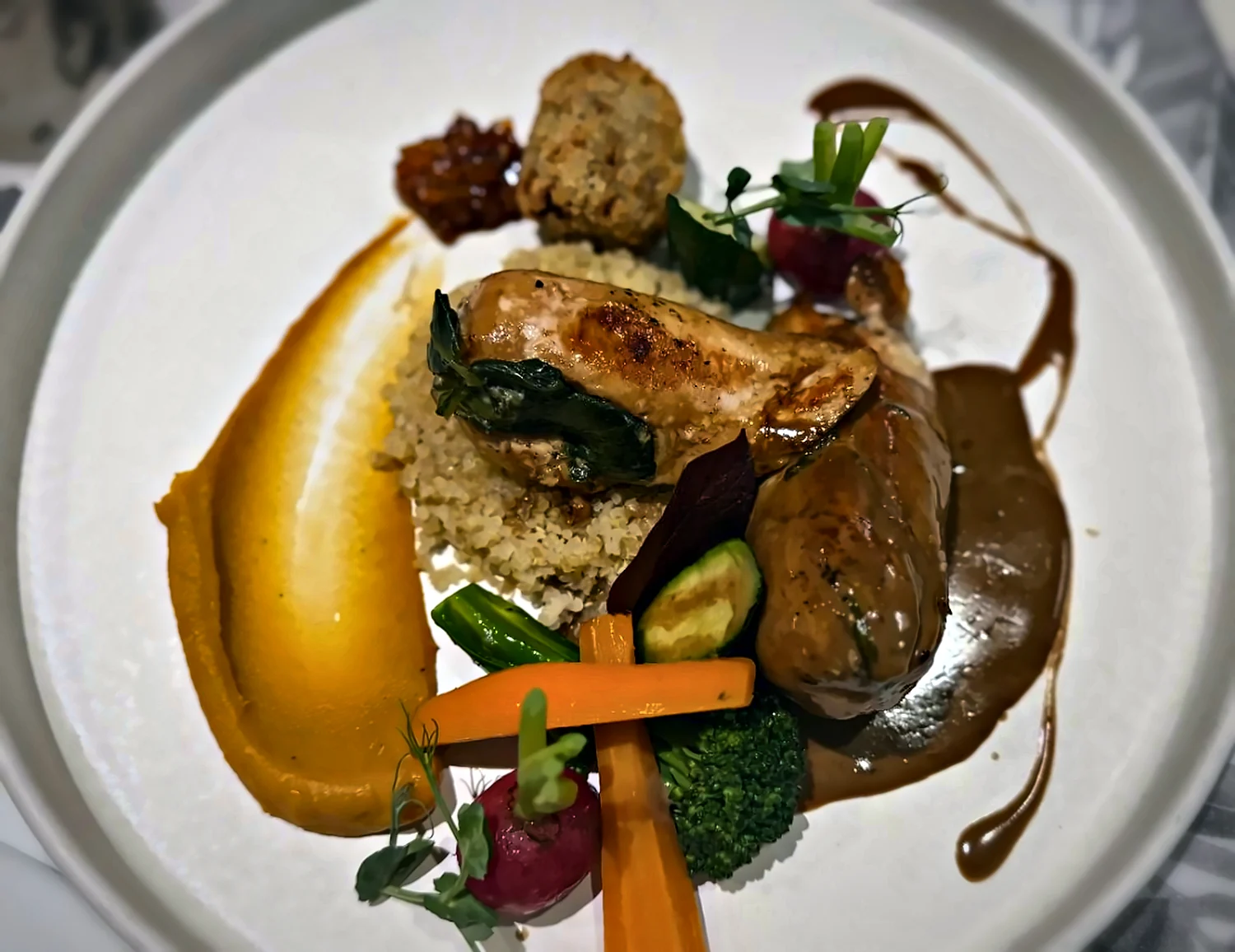 Stuffed chicken breast on quinoa with pumpkin purée